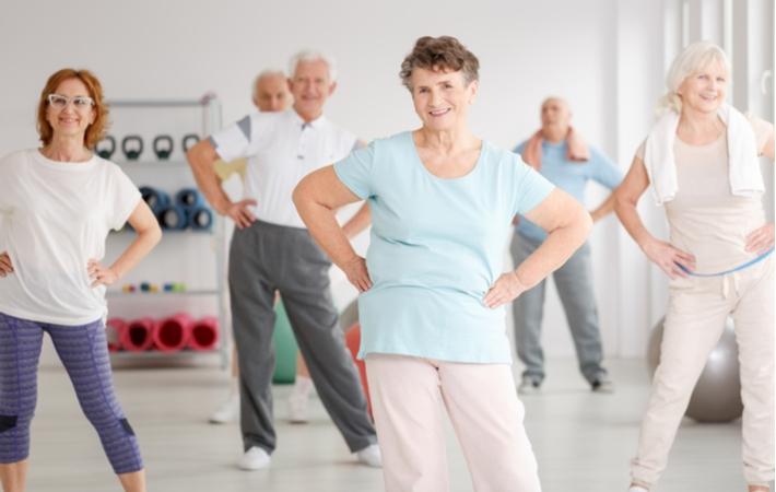 A group of active seniors exercising during a fitness class