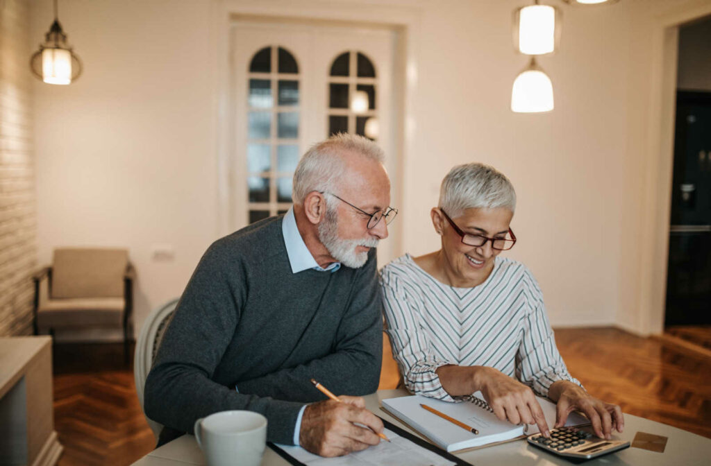 An elderly couple working on their finances.