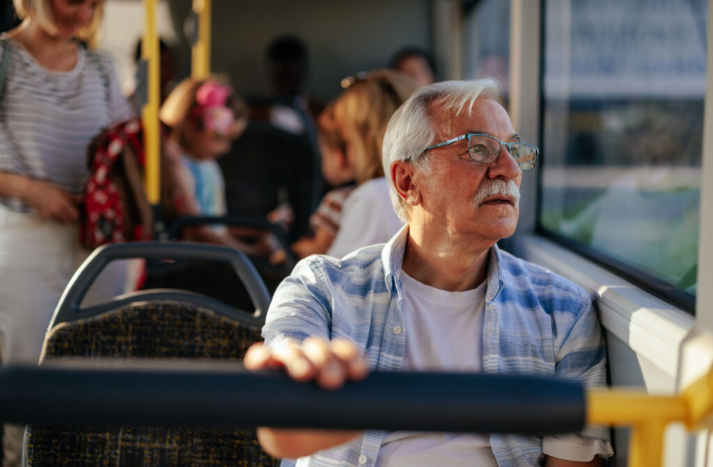 Senior man riding the bus.