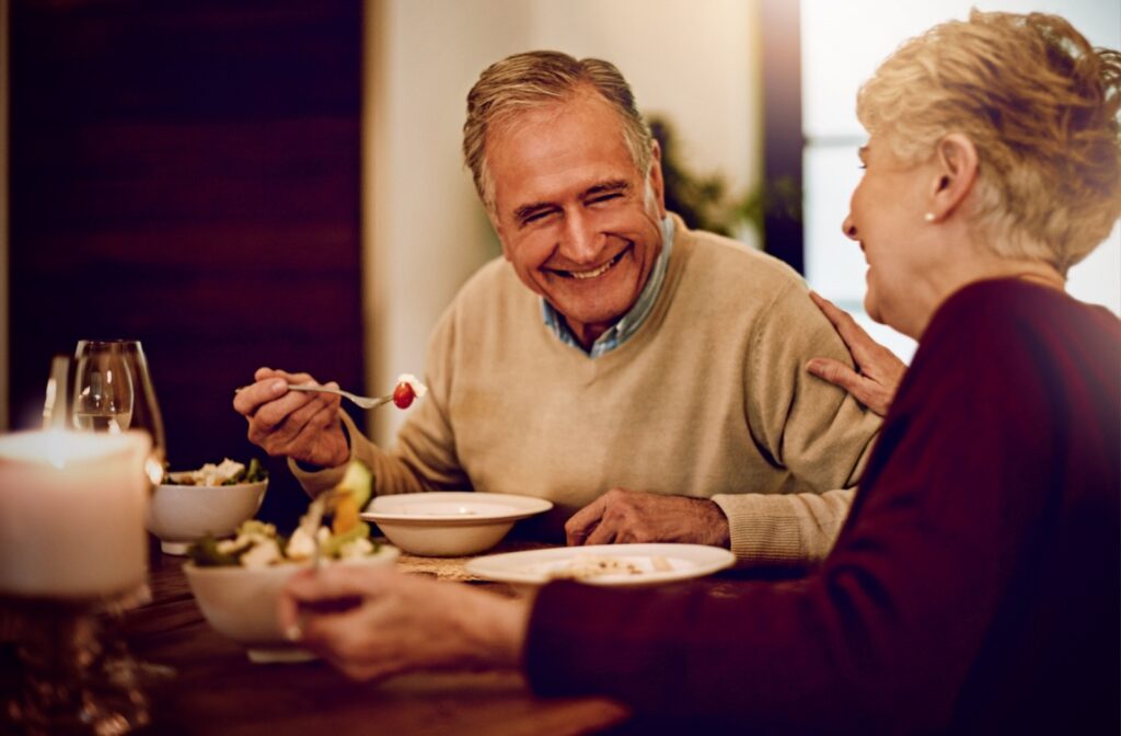 Senior couple eating dinner together.