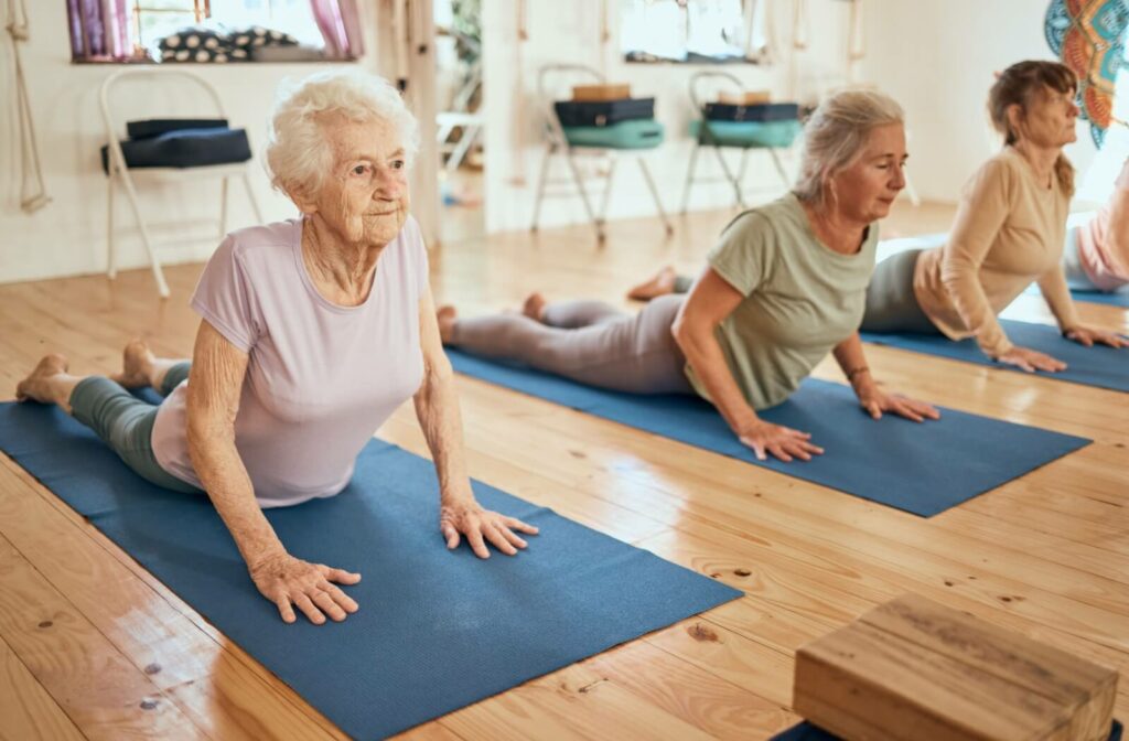 Yoga, stretching and senior women at a wellness