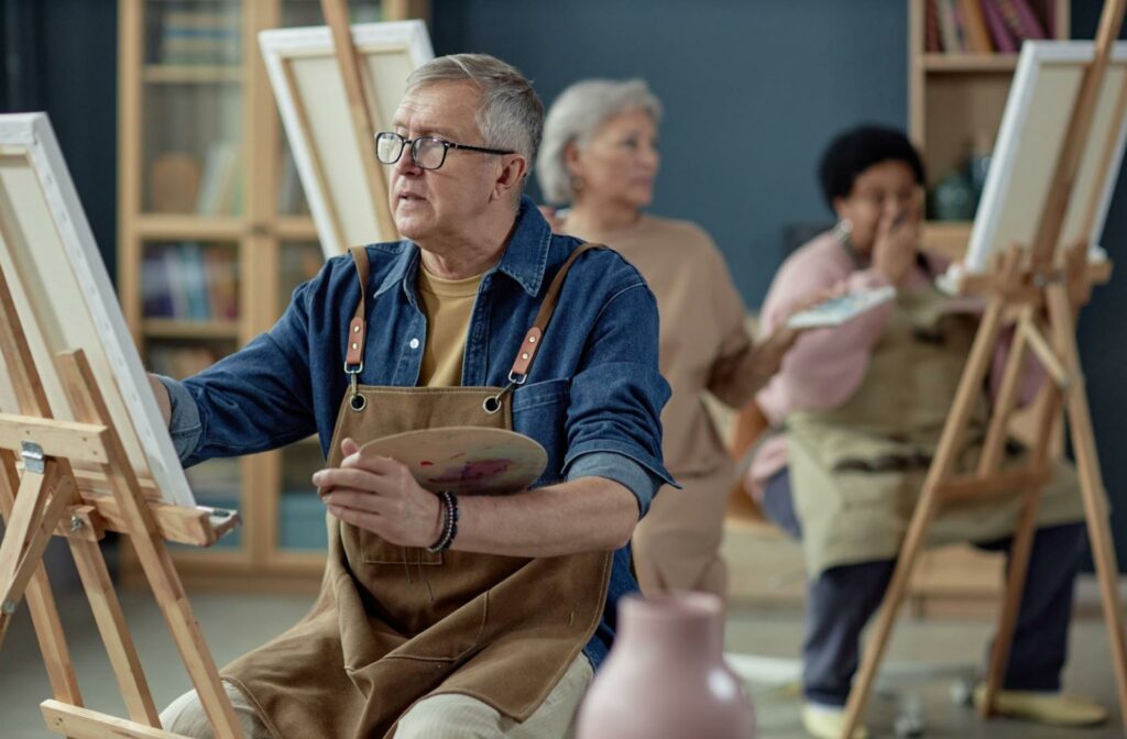 An older adult rediscovers their love for painting thanks to a workshop offered at their senior living community.